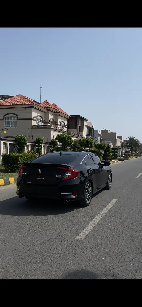 Black Civic under lights for VIP transfer