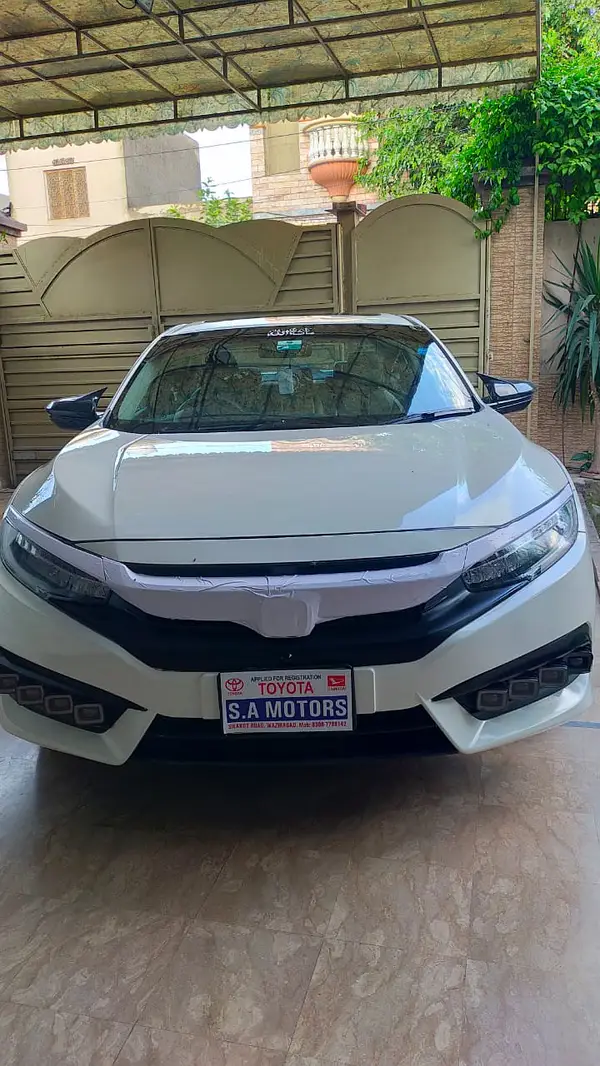White Honda Civic latest model for rent in Lahore