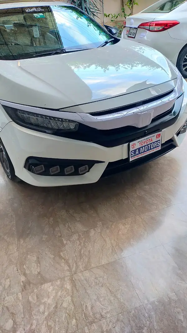 White Civic parked with clean rear view