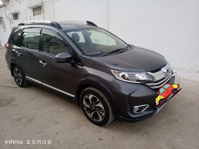 Side angle of black Honda BR-V available for rent