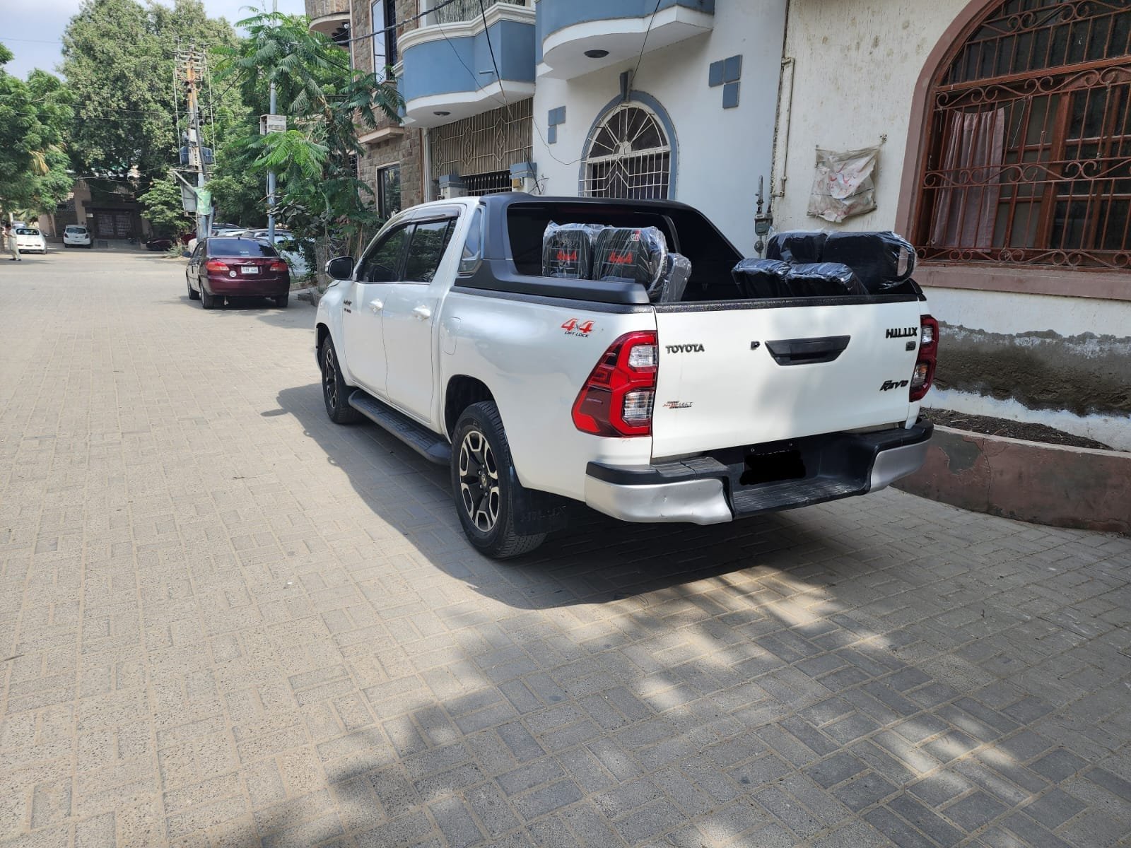 Side view of white Revo parked in Islamabad