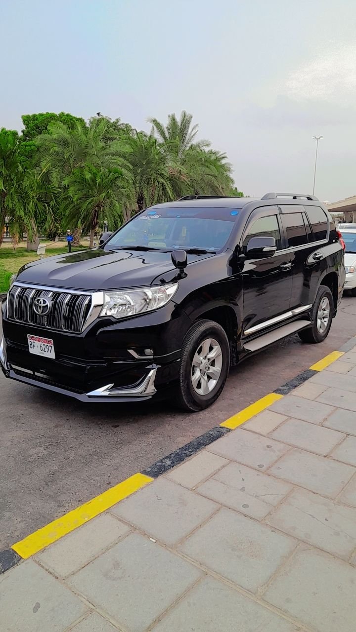 Toyota Prado parked at airport for pickup