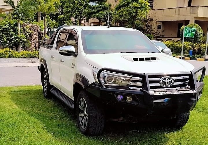 White Toyota Hilux Revo for rent in Lahore and Islamabad